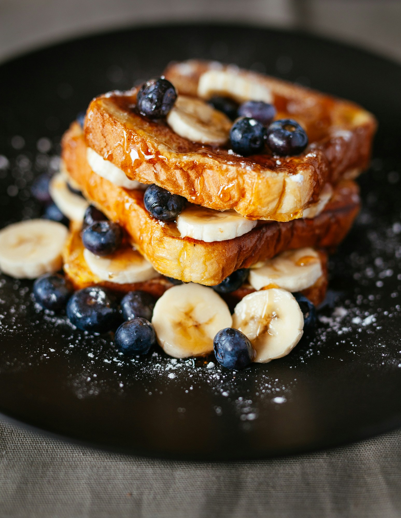 Brioche French Toast with blueberries, banana and maple syrup